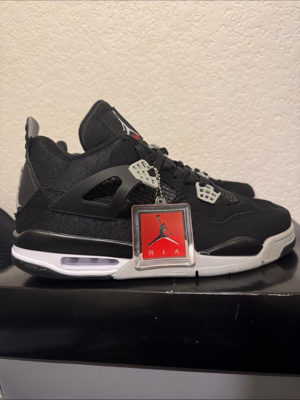 Jordan 4 black canvas Black and Grey Retro 4 Sneakers with Red Jumpman Tag